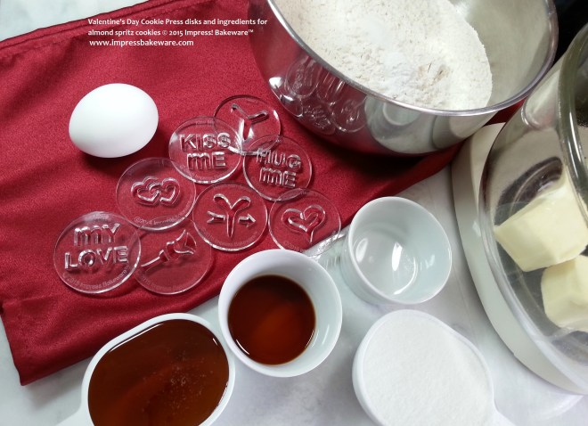 Valentine's Day Cookie Press disks and ingredients for almond spritz cookies © 2015 Impress! Bakeware™