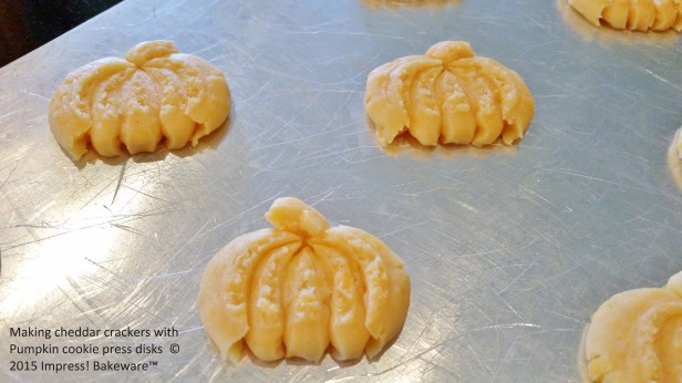 Making cheddar crackers with Pumpkin cookie press disks © 2015 Impress! Bakeware™