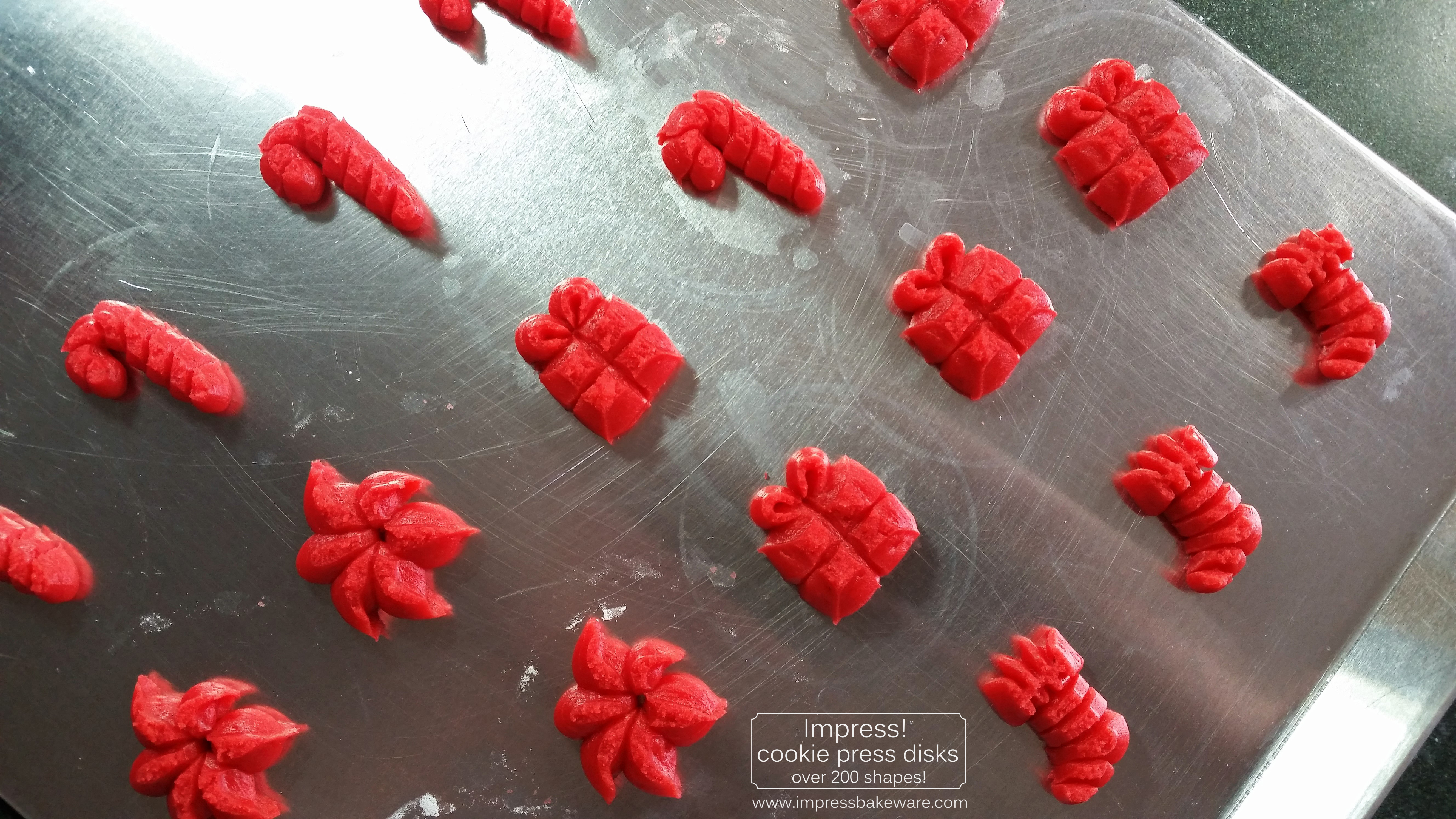 Stocking Poinsettia Candy Cane and Gift Almond Spritz Cookies © 2016 Impress! Bakeware, LLC cookie press.jpg