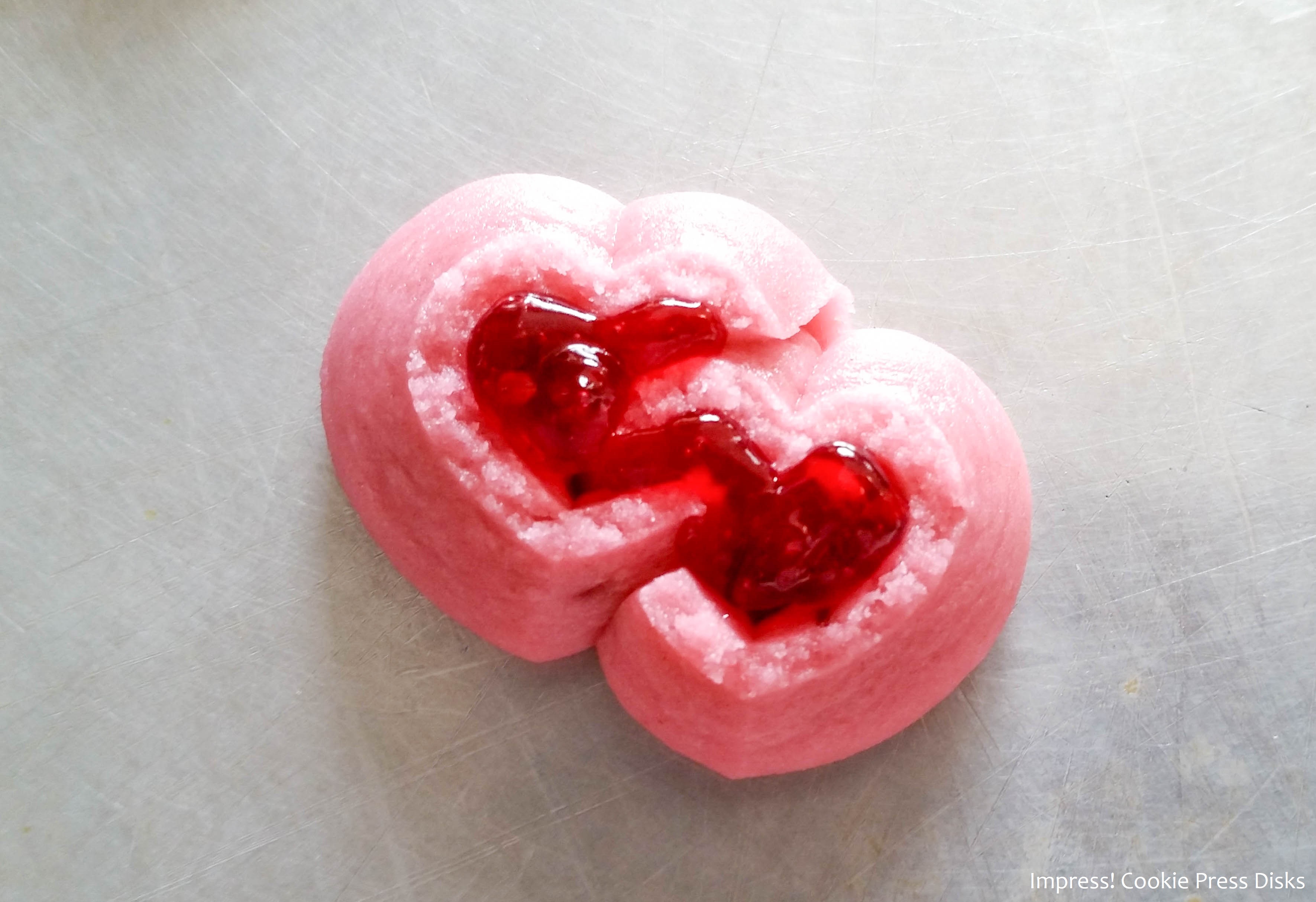 j Raspberry Thumbprint Valentine’s Spritz Cookies cookie press w © 2018 Impress! Bakeware, LLC.jpg