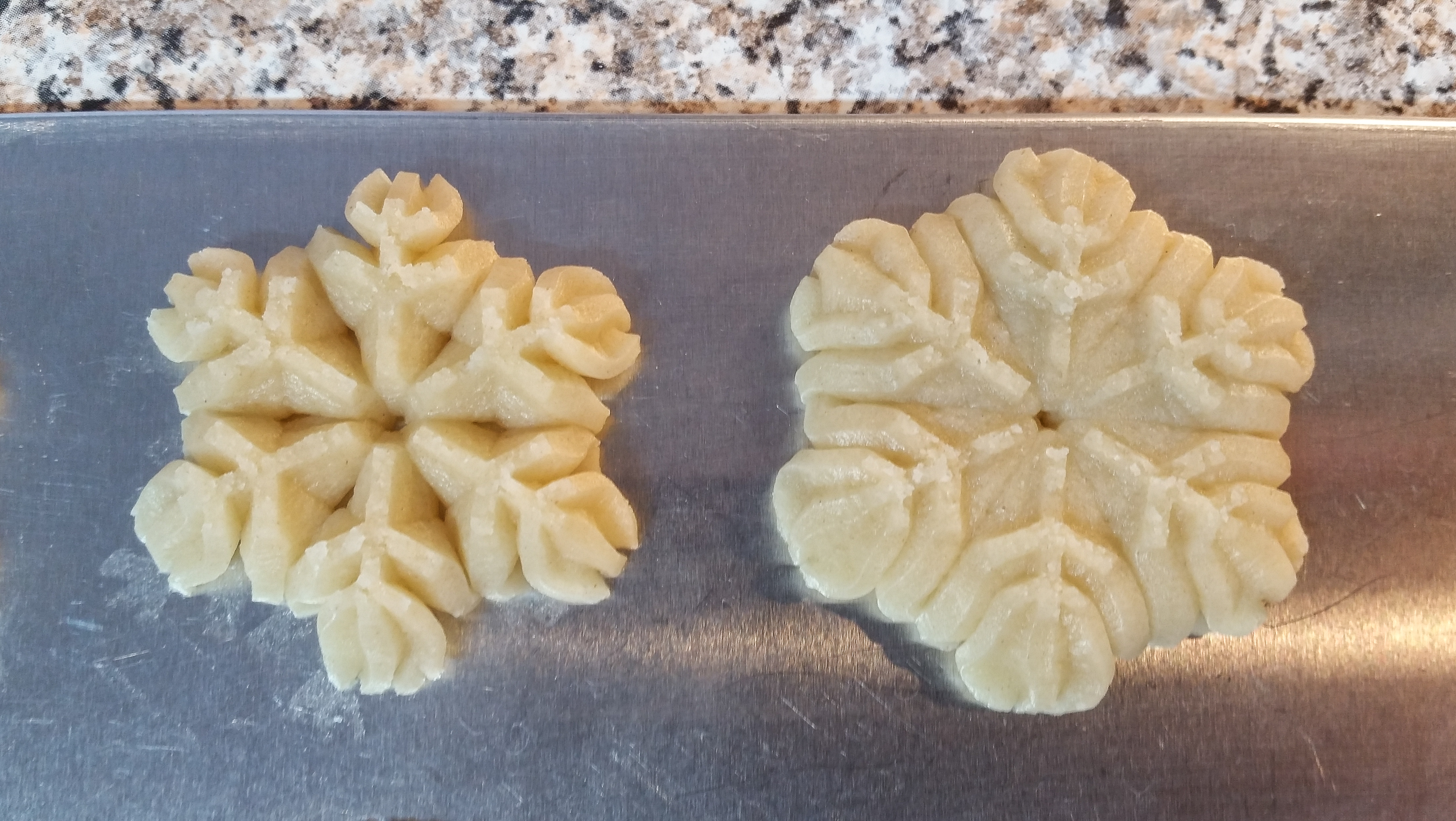 Snickerdoodle Spritz Snowflakes a © 2019 Impress! Bakeware, LLC