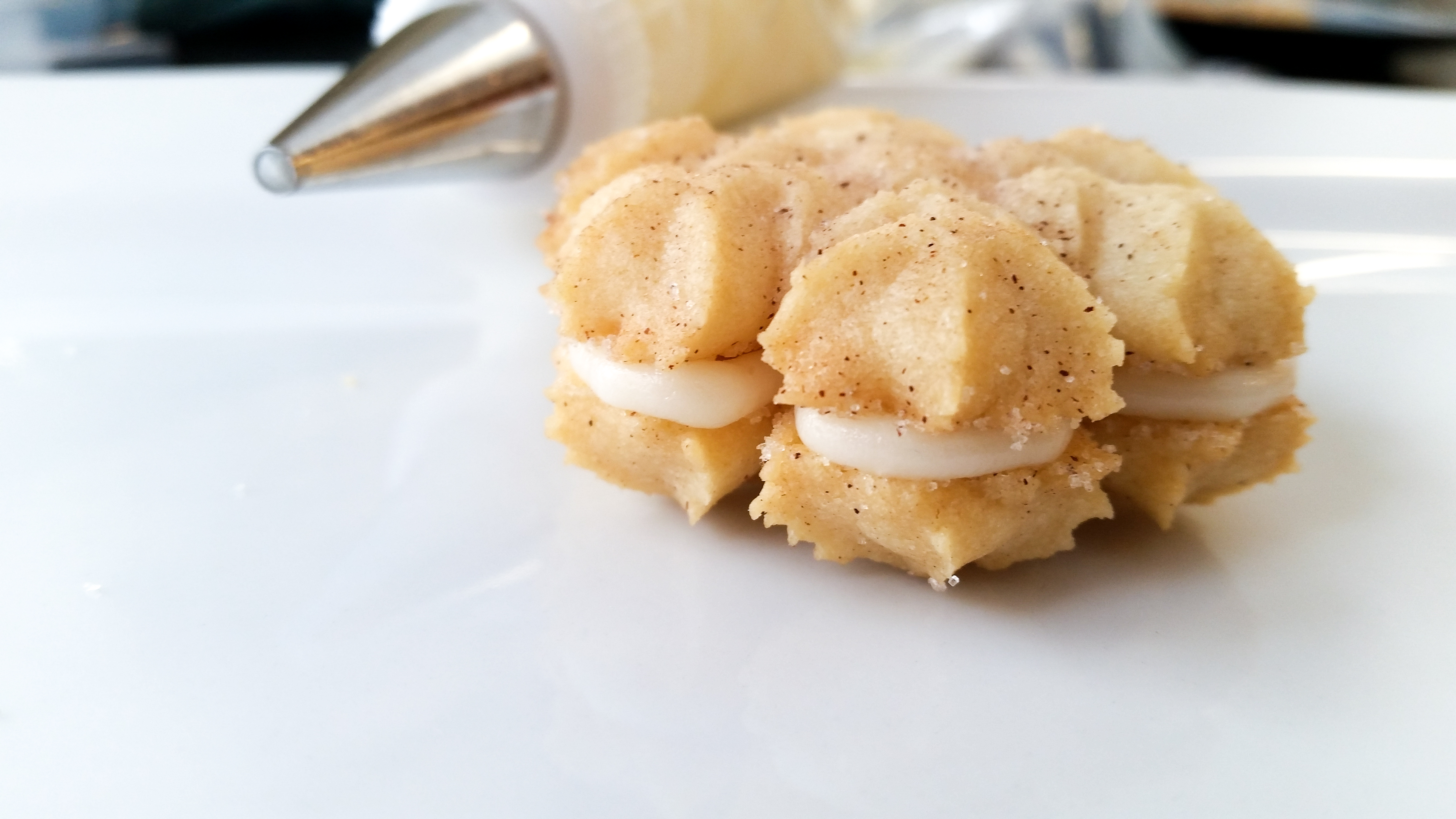 Snickerdoodle Spritz Snowflakes sandwiches © 2019 Impress! Bakeware, LLC b